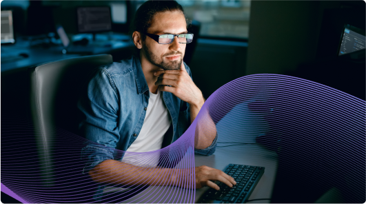 man looking at desktop monitor