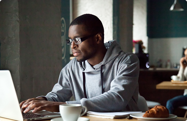 African-American man using laptop